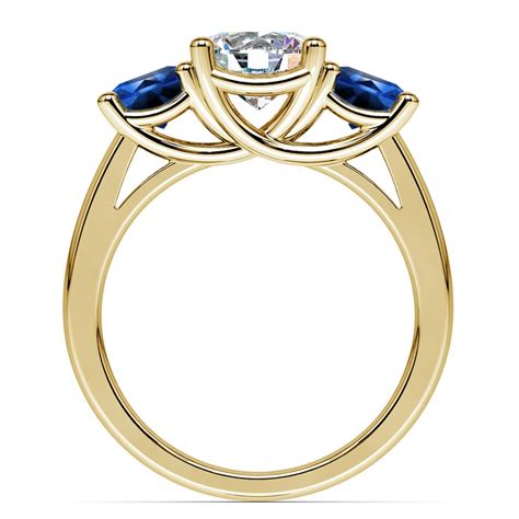 Three Stone Sapphire And Diamond Ring In Yellow Gold