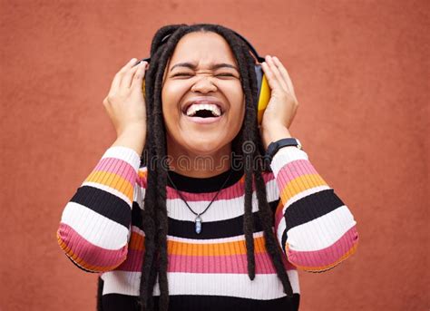 Black Woman Music Headphones And Smile By Wall In City For Walk