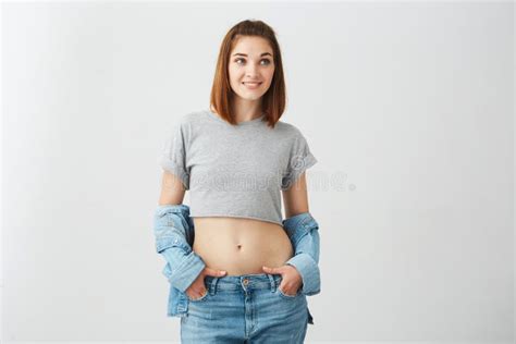 Cute Beautiful Natural Brunette Girl Cleaning Face With Cotton Sponge Smiling Looking At Camera