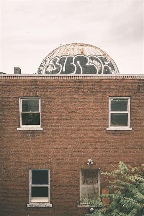 Brown Brick Walled Building · Free Stock Photo