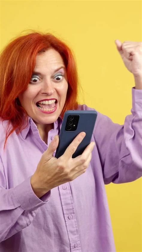 Excited Mature Redheaded Woman Celebrati Stock Video Pond