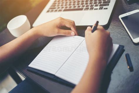 Close Up Of Young Beautiful Woman Hands Writing And Work With L Stock