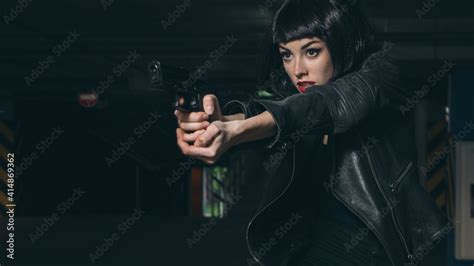 Beautiful Brunette Sexy Spy Agent Killer Or Police Woman In Leather Jacket And Jeans With A