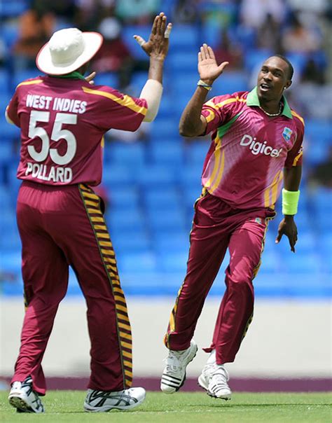 Dwayne Bravo And Kieron Pollard Celebrate The Dismissal Of Graeme Smith