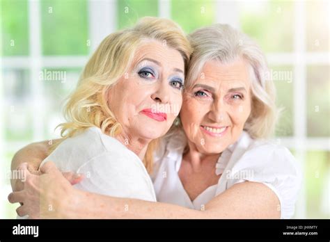 Mature Woman Hugging Mother Stock Photo Alamy