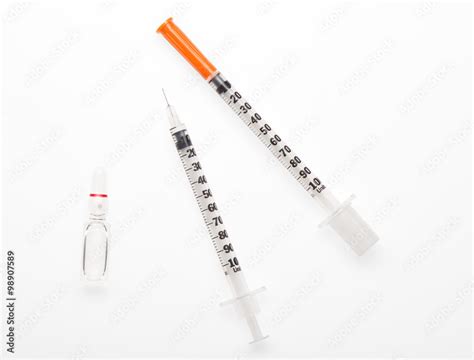 Plastic syringe with needle closed by protective cap, plastic syringe ...