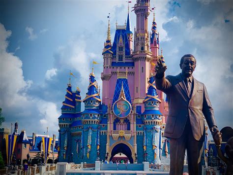 Download "Majestic view of the Disney Castle with Walt Disney Statue ...