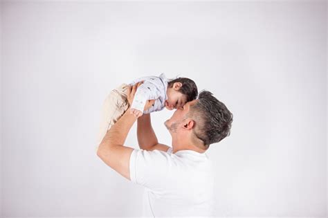 Beautiful Photo Of Dad Holding His Baby Stock Photo Download Image