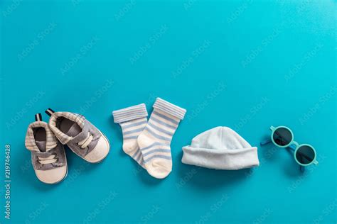 Baby boy clothes and accessories on bright blue background Stock Photo ...