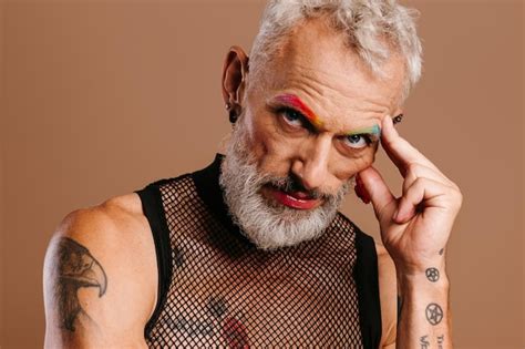 Premium Photo Portrait Of Bearded Mature Gay Man With Rainbow Colored Eyebrows Standing