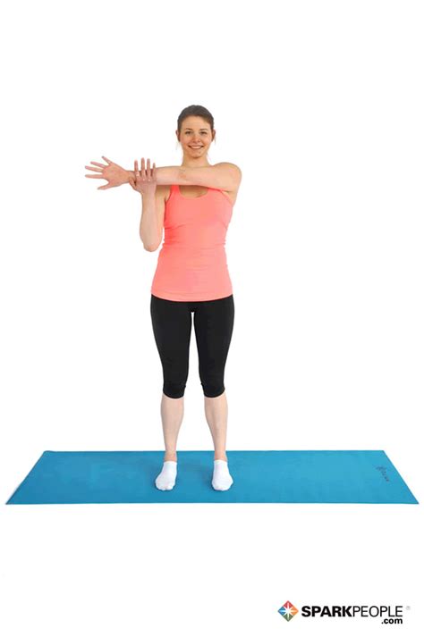 Standing Shoulder Stretch Exercise Demonstration | SparkPeople