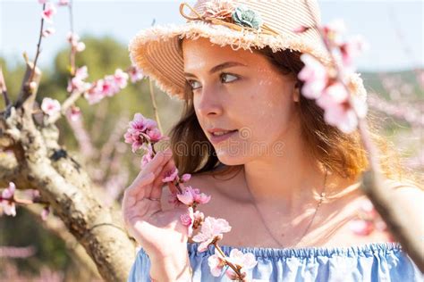Beautiful Blonde Girl With Long Hair In A Pink Dress In Blooming Garden Stock Image Image Of