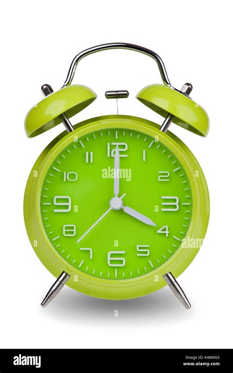 Green Alarm Clock With The Hands At 4 Am Or Pm Isolated On A White