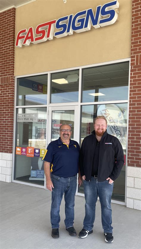 Father-Son Business Owners on FastSigns Franchise Opportunity