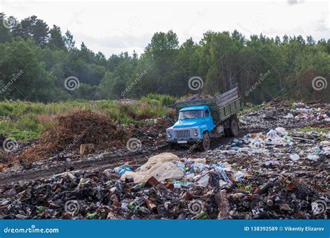 Old Garbage Truck Rides on Illegal Garbage Dump in the Woods Stock ...