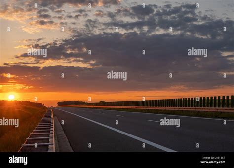 empty highway during a spectacular sunset Stock Photo - Alamy