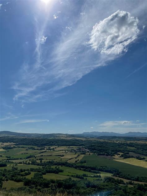 The Sun Shines Brightly Over An Expansive Landscape