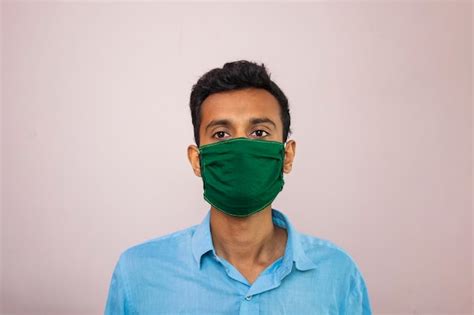 Premium Photo Portrait Of Man Wearing Mask Against White Background