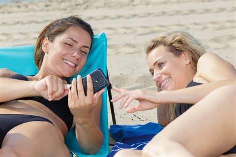 Women On Beach Checking Cellphone Stock Photo Image Of Bikini Technology