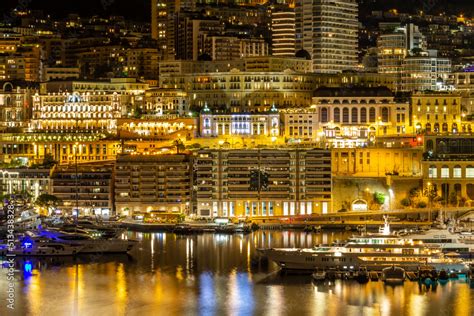 Monaco principality at night, luxury yachts at Port Hercules waterfront ...