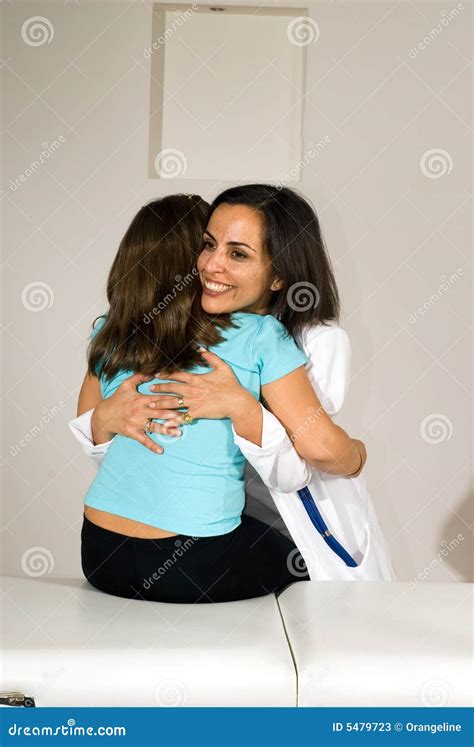 Standing Nurse Hugging A Patient Sitting On Bed Stock Image Image Of