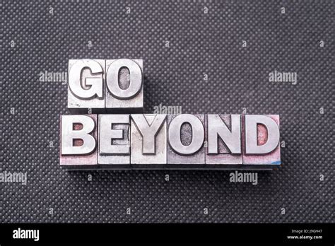 Go Beyond Phrase Made From Metallic Letterpress Blocks On Black