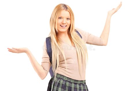 Happy Blond Female With Broken Arm Holding A Crutch Posing Stock Photo