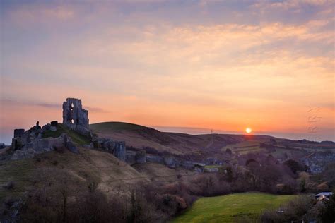 Iconic ruins of Corfe Castle in Dorset at sunrise