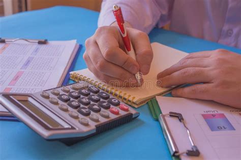 Businessman Using A Calculator To Calculate The Numbers Businessman