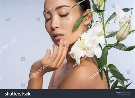 Asian Cute Woman Naked Shoulders Smelling Stock Photo Shutterstock