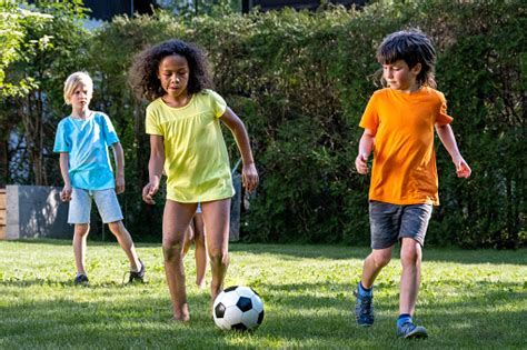 Children Playing Football Stock Photo - Download Image Now - American ...