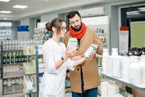 Pharmacist With Client In The Pharmacy Store Stock Image Image Of