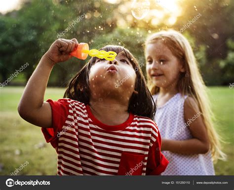 Kids blowing bubbles on nature Stock Photo by ©Rawpixel 151250110