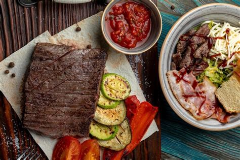 Premium Photo Steak With Grilled Vegetables Served On A Wooden Tray