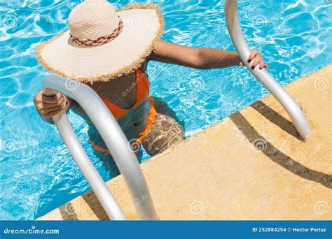 Woman In Sun Hat And Bikini Getting Out Of Sunny Summer Swimming Pool Stock Photo Image Of