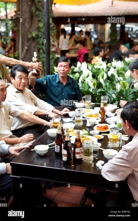 Vietnam Hanoi Men Drink And Eat Lunch At A Traditional Street Food Restaurant Called Quan An