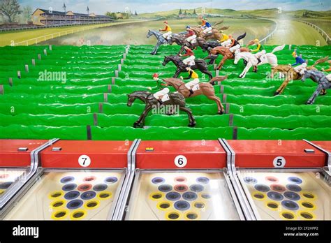 Detail of the plastic, toy, model race horses at the game at Funland ...