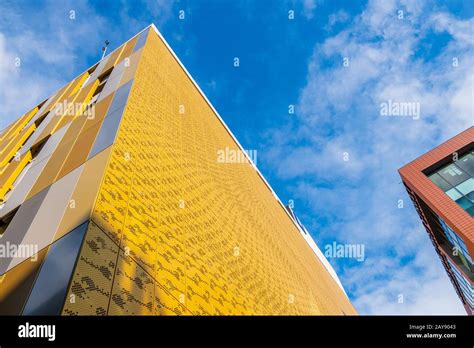 Contrasting Colors And Shapes On Building Facades Against The Sky In