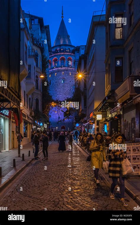 Night view of a street near Galata Tower, a medieval stone tower in Istanbul and popular tourist ...