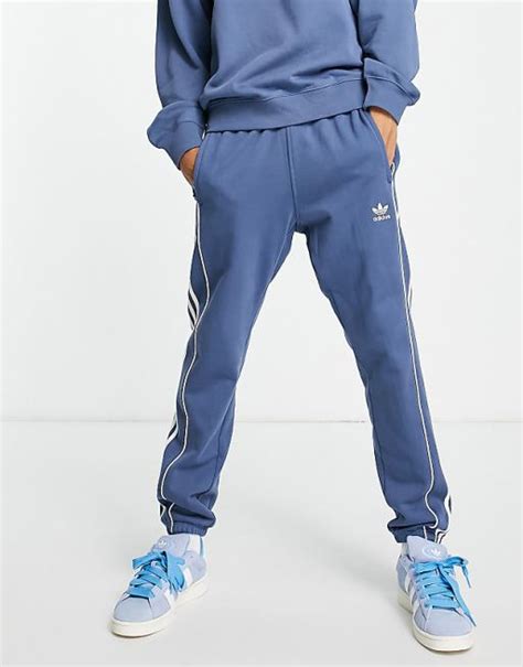 Adidas Originals Rekive Three Stripe Joggers In Blue Asos