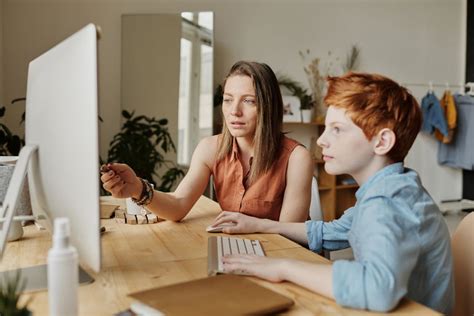 Photo of Woman Teaching His Son · Free Stock Photo