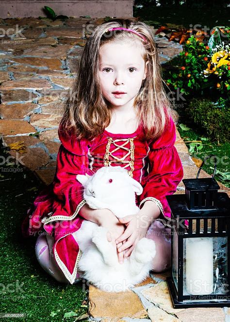 Portrait Of Girl In Princess Costume With The White Rabbit Stock Photo