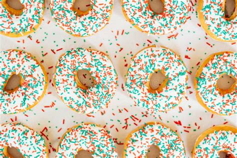 Donuts with White Chocolate Cream and Sprinkles Sugar Stock Photo - Image of green, icing: 106422720