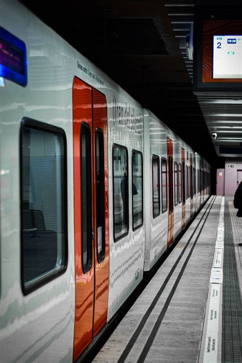 White and orange train in train station photo – Free Train station ...