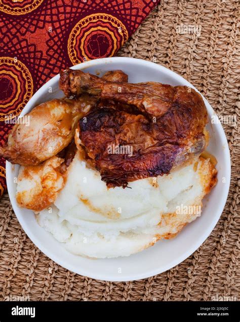 Traditional south African pap and quarter chicken, maize meal with roast chicken Stock Photo - Alamy