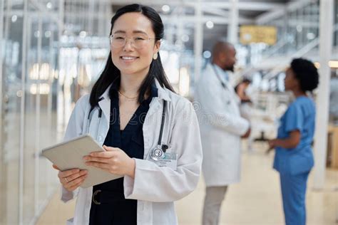 Asian Woman Doctor With Tablet And Portrait Smile In Hospital For Healthcare Telehealth And