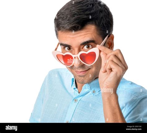 Handsome man wearing heart-shaped glasses on white background Stock ...