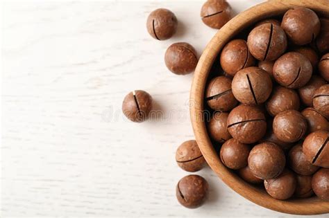 Bowl With Organic Macadamia Nuts On Wooden Table Stock Image Image Of