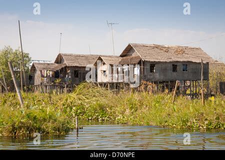 Basic Thatched Stilt Houses On The Flooded Sepik River Near Angoram In