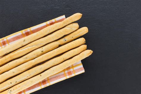 Premium Photo Fresh Italian Grissini Breadsticks Served On Black